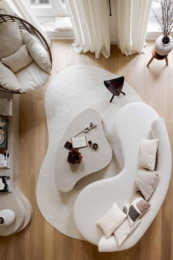 sofa curvo com mesa organica